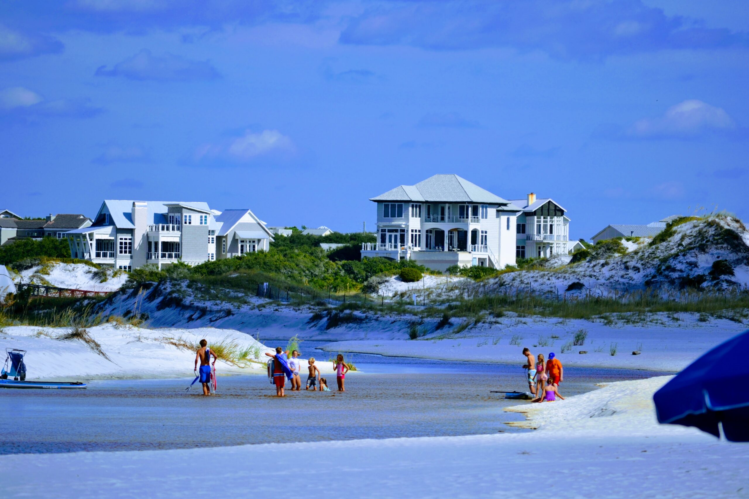 Homes behind the dunes at the Camp Creek lake outflow in Watersound Beach, Walton County, Florida