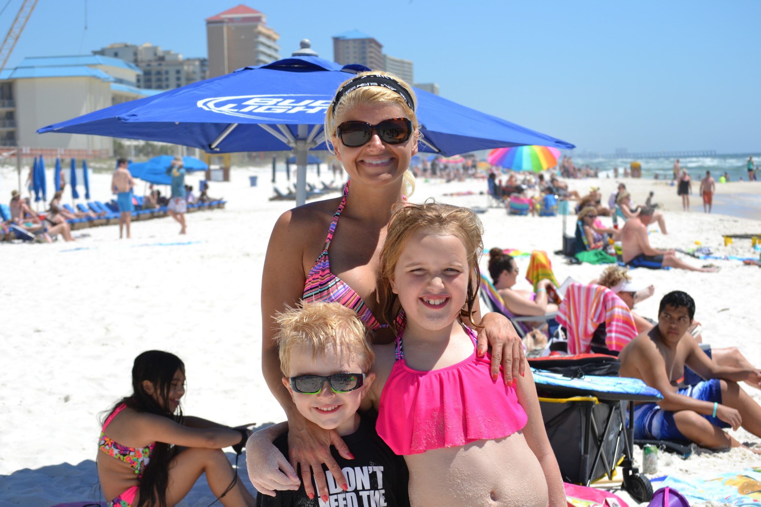 A family on the beach in front of Aqua, Panama City Beach, Florida