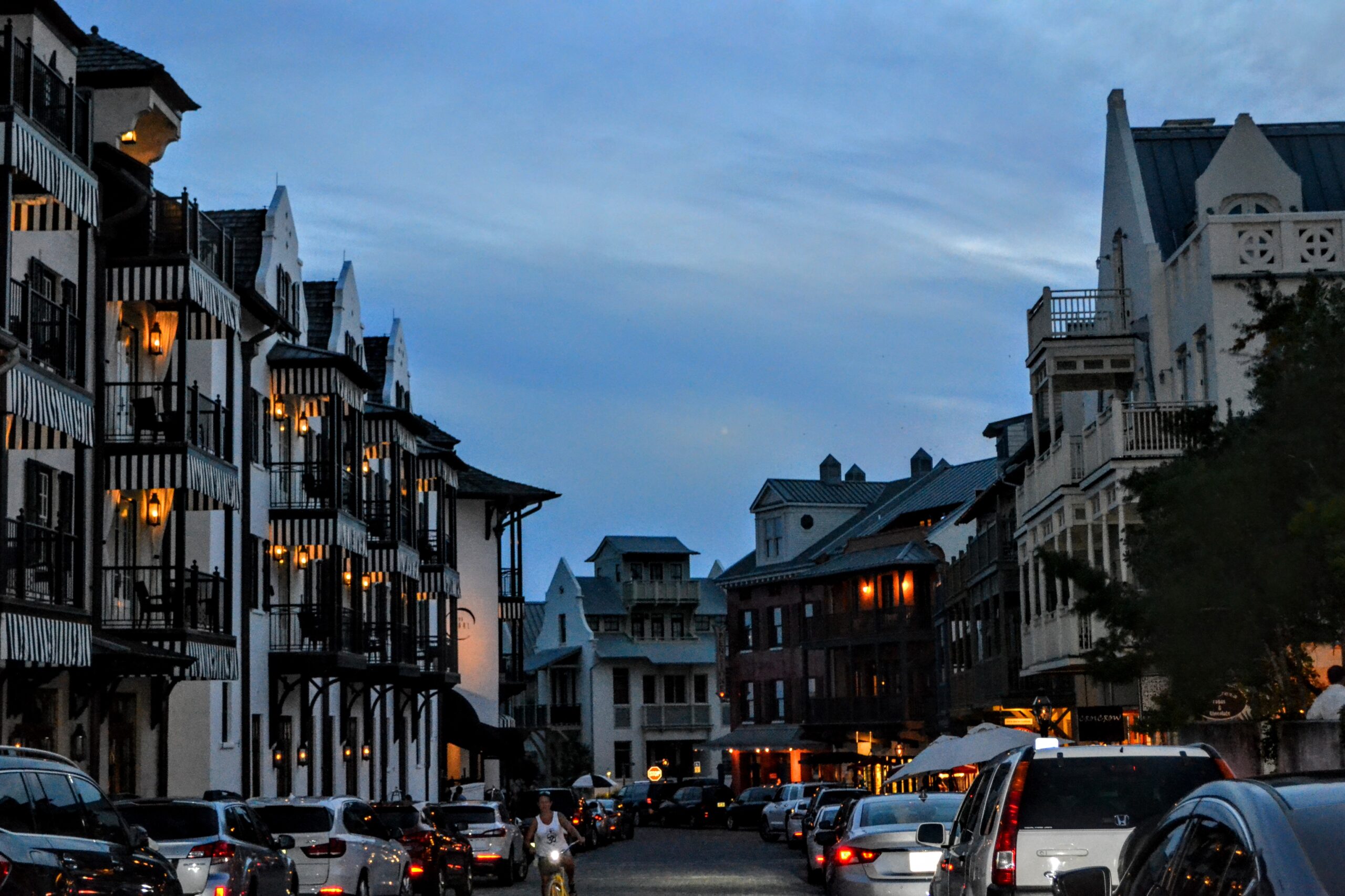 Downtown Rosemary Beach at dusk, European-style architecture along a cobblestone street