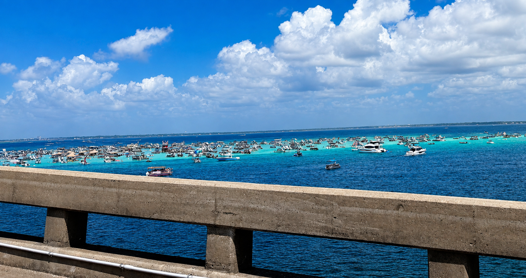 Destin Crab Island shot from the bridge. Sunny day partly cloudy. Lot's of Boats.