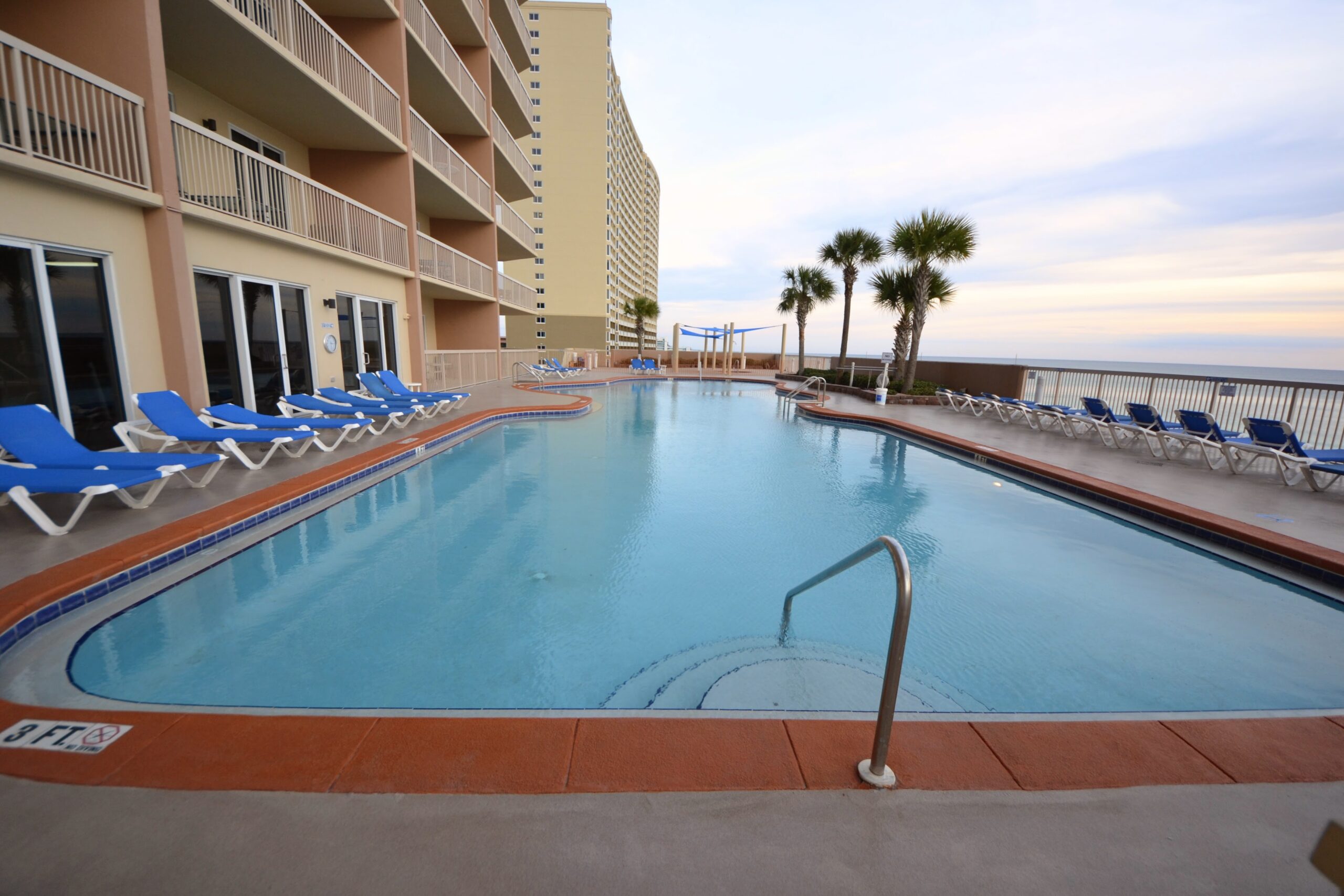 Pool deck at Sunrise Beach Condos overlooking the Gulf of Mexico