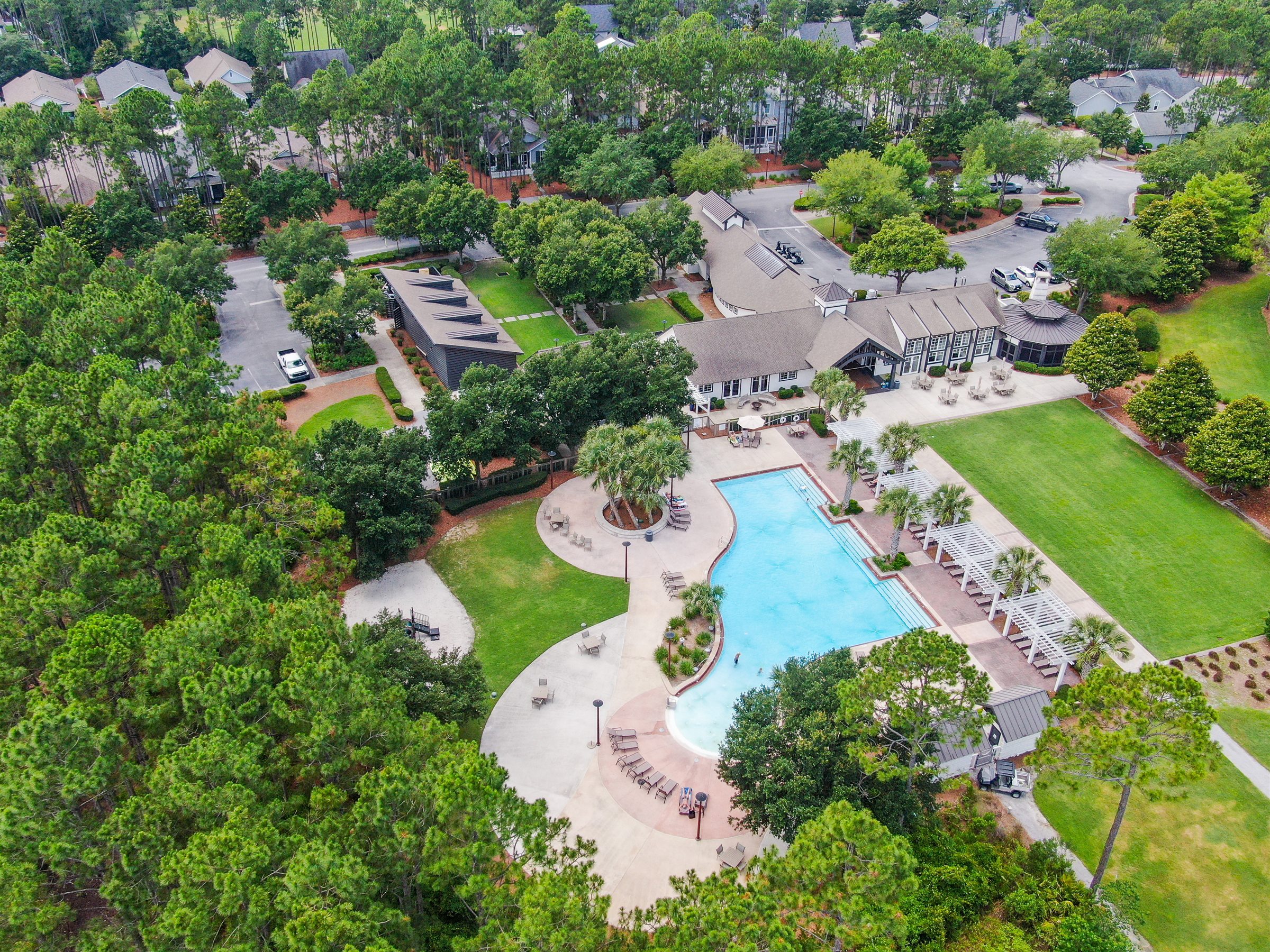 Aerial view of the community pool and pool deck at Watersound Origins in Walton County, Florida